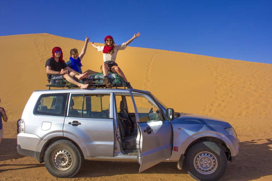 on top of car in sahara