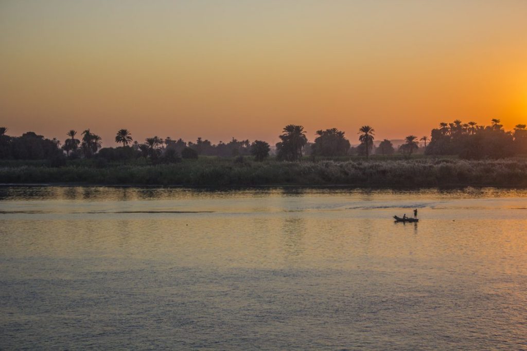 Man in boat Sunset over the Nile Egypt Travel Talk Tours Solo Femele Travel