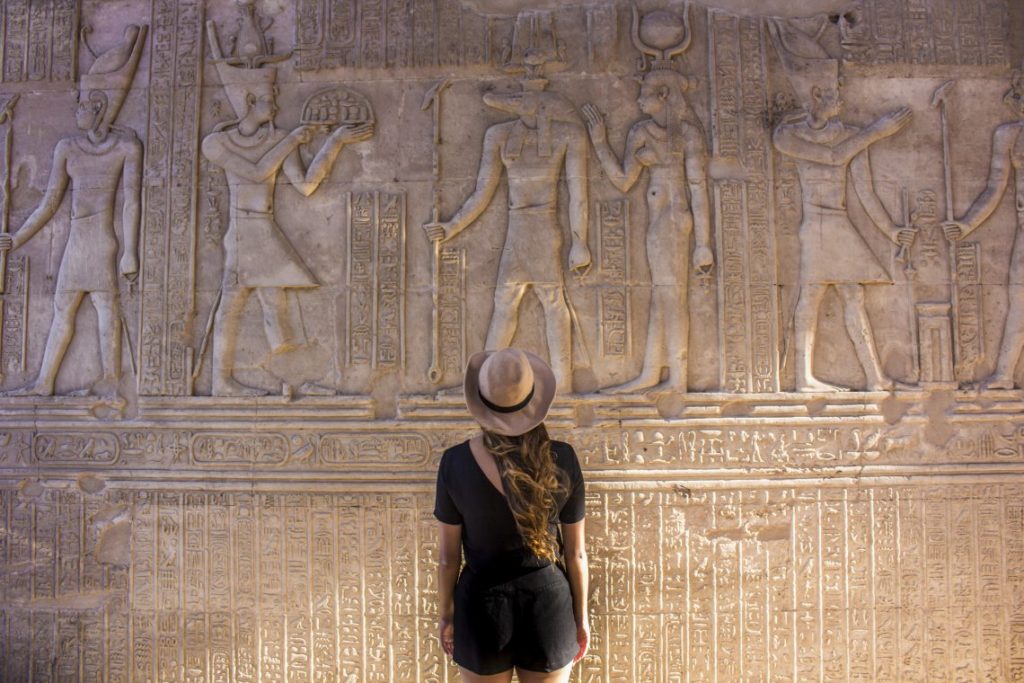 Temple of Kom Ombo reading Hyroglifics - Travel Talk Tours Solo female travel egypt