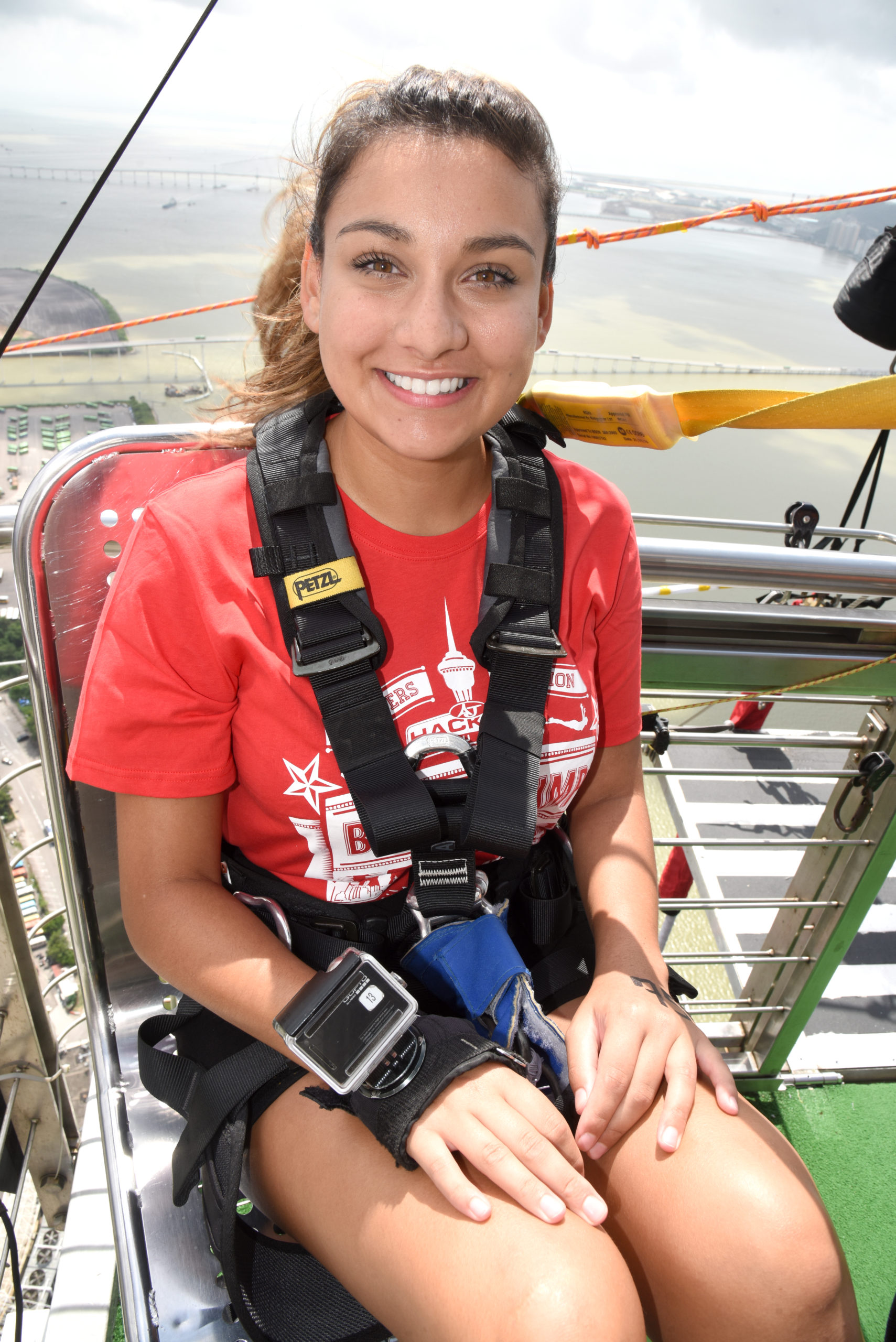 Sitting in the preperation chair at macau tower bungee jump day trip to macau worlds highest bungee jump